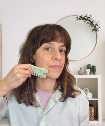Jade gua sha comb along jawline