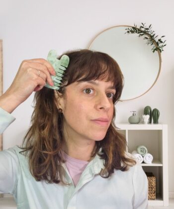 Jade gua sha comb through hair and scalp